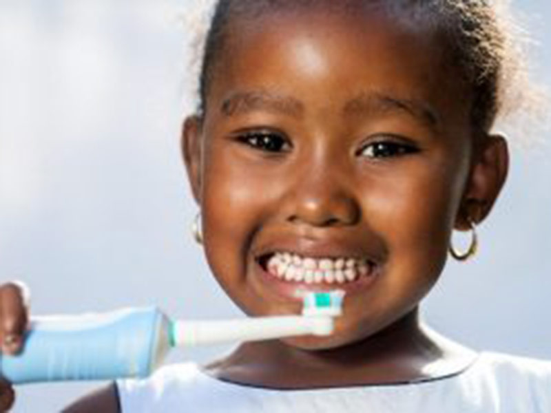 a girl with toothbrush