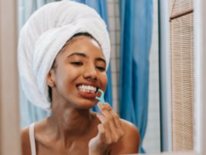 women brushing teeth