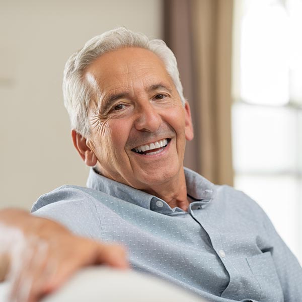 A Dentist smiling after providing personalized dental treatment in Phoenix, AZ