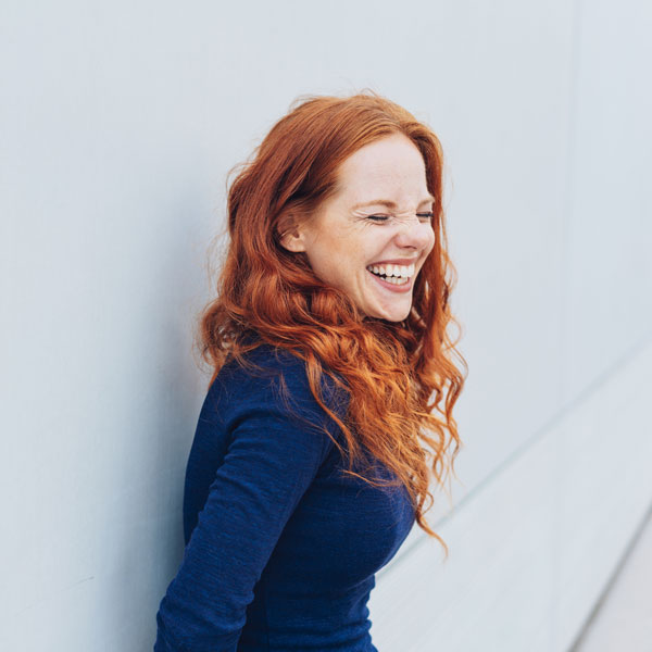 Patient smiling after a laser dental cleaning in Phoenix, AZ