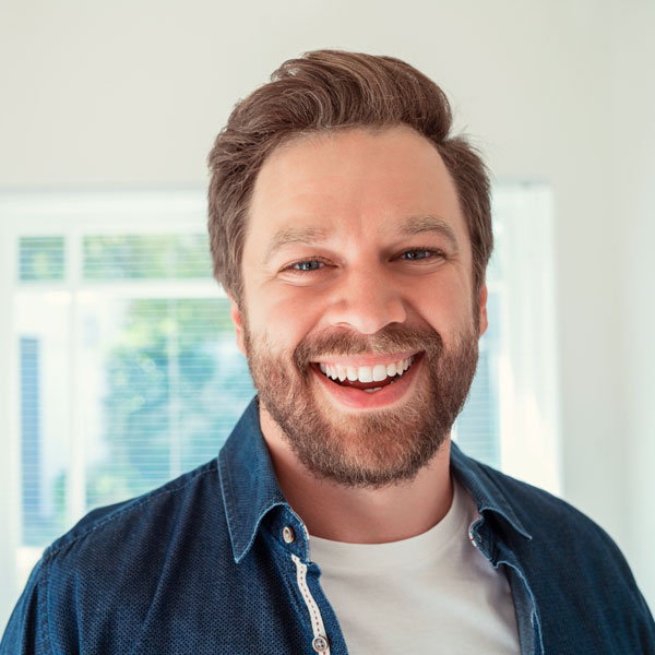 Patient smiling after a laser dental exams in Phoenix, AZ