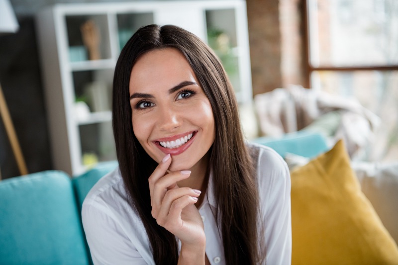 Woman smiling after getting porcelain dental veneers in Phoenix, AZ